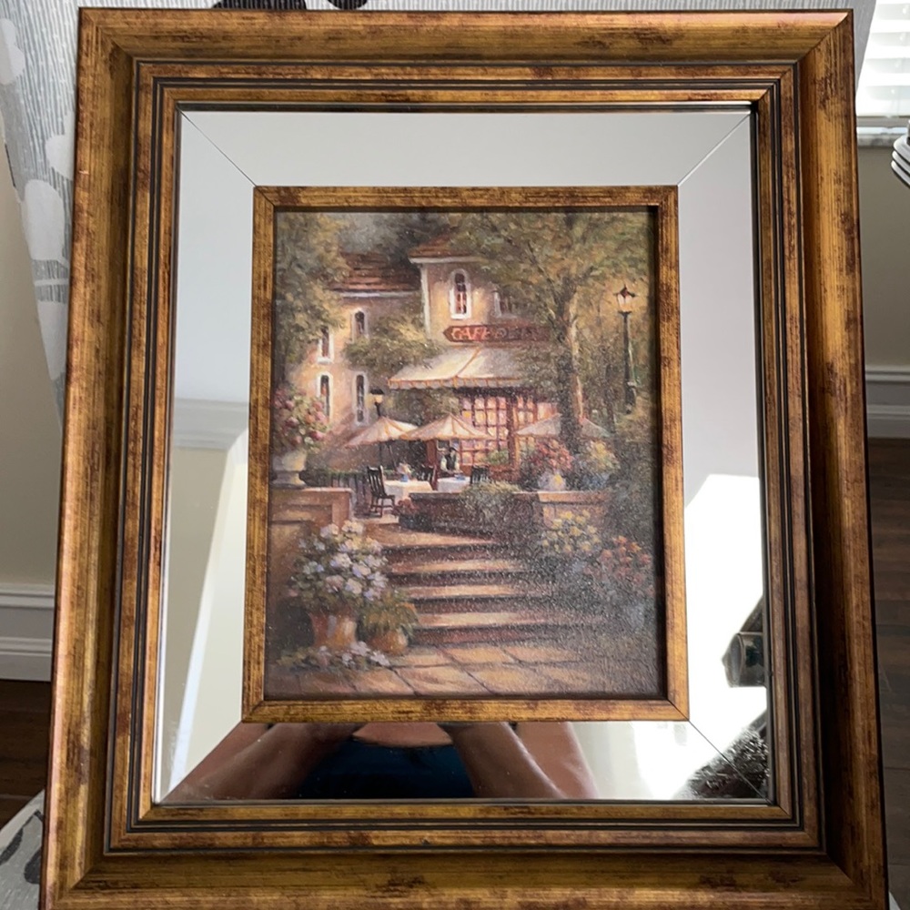Cafe scene print framed . Frame is brown with mirror inlay. Great accent